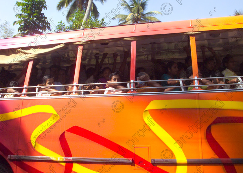 Kerala Crowded Bus 
 Brightly coloured bus, Kerala, Southern India 
 Keywords: India, Kerala, bus, ethnic people, transport, Southern India
