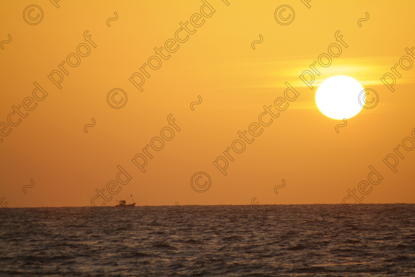 Goa A 081 
 Sunset at Varca, Goa 
 Keywords: sunset, sun, sea, sky, fishing boat, Arabian Sea, Varca, Salcette, India, Southern India, travel, tourism,