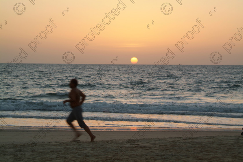 Goa A 099 
 Varca Beach, Goa at Sunset 
 Keywords: Goa, sunset, sun, sand, sea, sky, beach, Arabian Sea, Varca, India, Southern India, Salcette, runner, travel, tourism, recreation,
