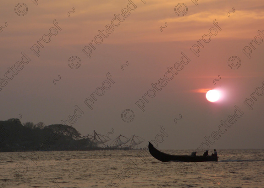 Cochin Chinese Fishing Nets 048 
 Sunset at Cochin, Kerala, Southern India with the Chinese fishing nets in the background 
 Keywords: sunset, boats, Cochin, Chinese fishing nets, India, Kerala, sun, sky, sea, Cochi, Southern India