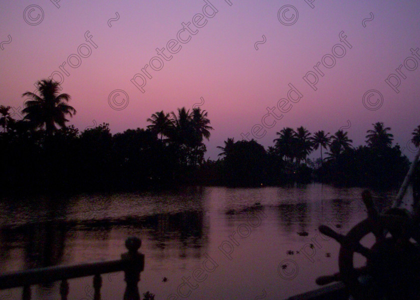 Kerala Backwaters Dusk 021 
 Dusk on the peaceful backwaters of Kerala, Southern India 
 Keywords: Sunset, dusk, waterways, canals, backwaters, Kerala, India, Southern India, Allepey, Alappuzha, houseboat, kettuvalam